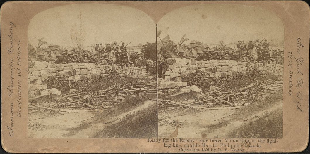 Ready for the Enemy: our brave Volunteers on the fighting line, outside Manila. Philippine Islands.